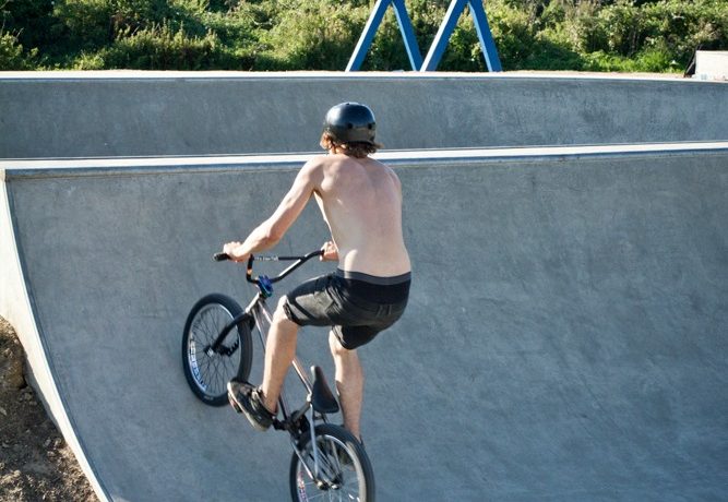 Hit the ramp at a good speed and start carving up the transition a little, if you carve across the ramp you can go higher and land smoother than just hitting it dead on.