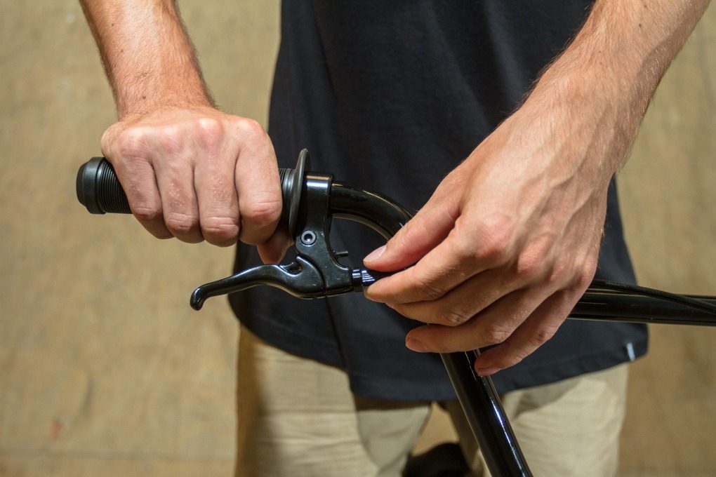 The brake should already be on the bike, the thing you’ll need to do is tune in the cable. Attach it to the lever, making sure the adjustment screw is set at a minimum (you might need this later).