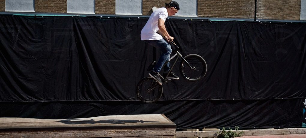Have your knees slightly bent and keep pulling back on the bars, keeping your weight hanging over the back end of the bike.