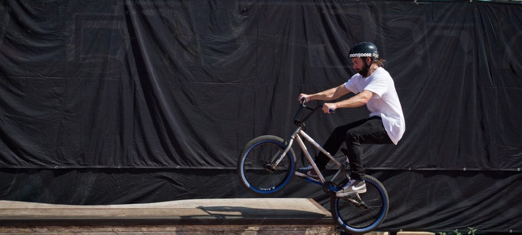 Approach the ledge almost parallel; as you hop, pull the back end up beneath you, keeping the front wheel just above level. You’re not going to tuck this up like you would in a normal hop.