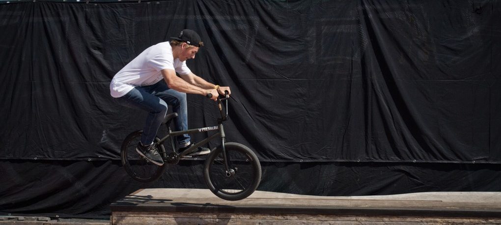 As you hop, tuck up the back end like you would in a regular hop. As you come up over the ledge start aiming the front peg down. At the same time, you want to let the back end drift over the top so the wheel can touch down on the top. It’s easy to slam down into a double peg here because the back end isn’t kicked over enough. If this is happening, just lean your hips towards the ledge a little when you hop, but keep the bars level, aiming the front peg at the ledge.