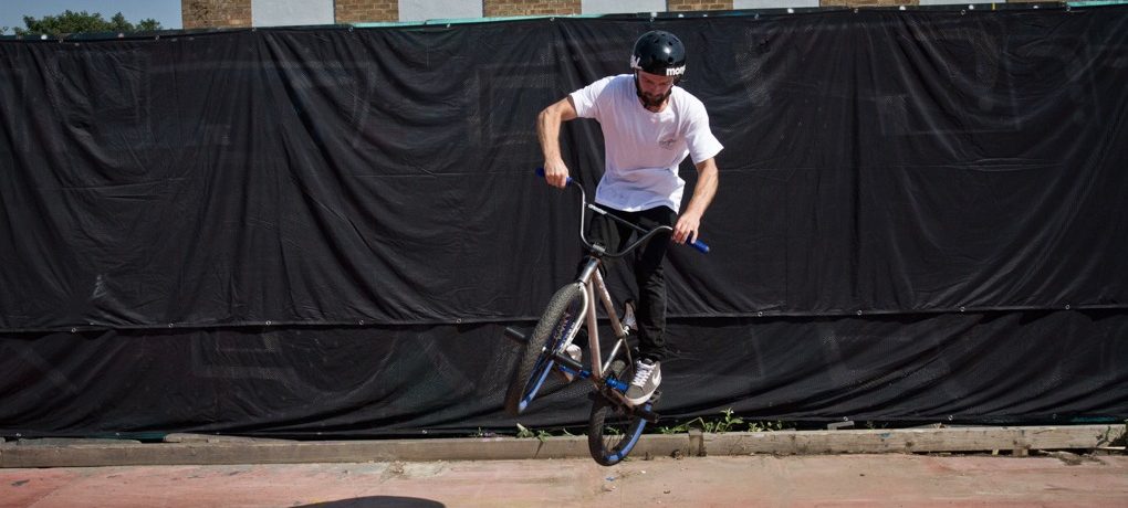 As the bike comes around to about ninety degrees, start pushing the bars forward so the bike levels out. You don’t need to worry too much about the 180 after this, the main thing is spinning and catching the bars. Now you’ve got the spin going, it’ll come around on its own.