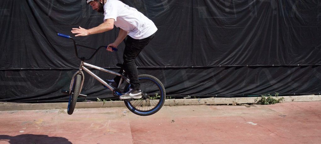 Really hop into the 360, as the bike comes to 180 spin the bars. The easiest way to throw them is away from the direction you spin.