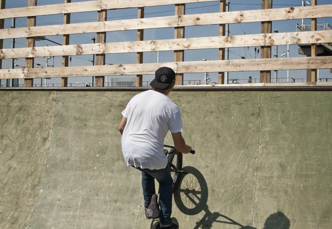 Start carving your bike towards the lip of the ramp, increasing the carve as you get about halfway up the quarter. You’re not going to air or leave the ramp, so all that speed you’ve got needs to be maintained in the carve you’re doing.