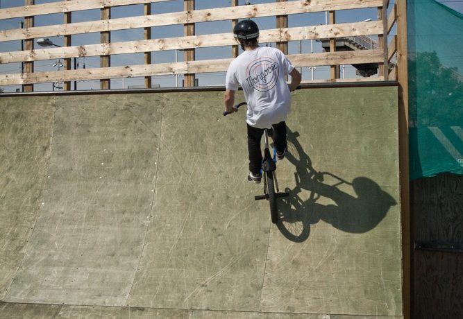 As your front wheel comes to the top of the ramp, you need to keep it up and out of the way. Start thinking about where the back wheel is going to go.