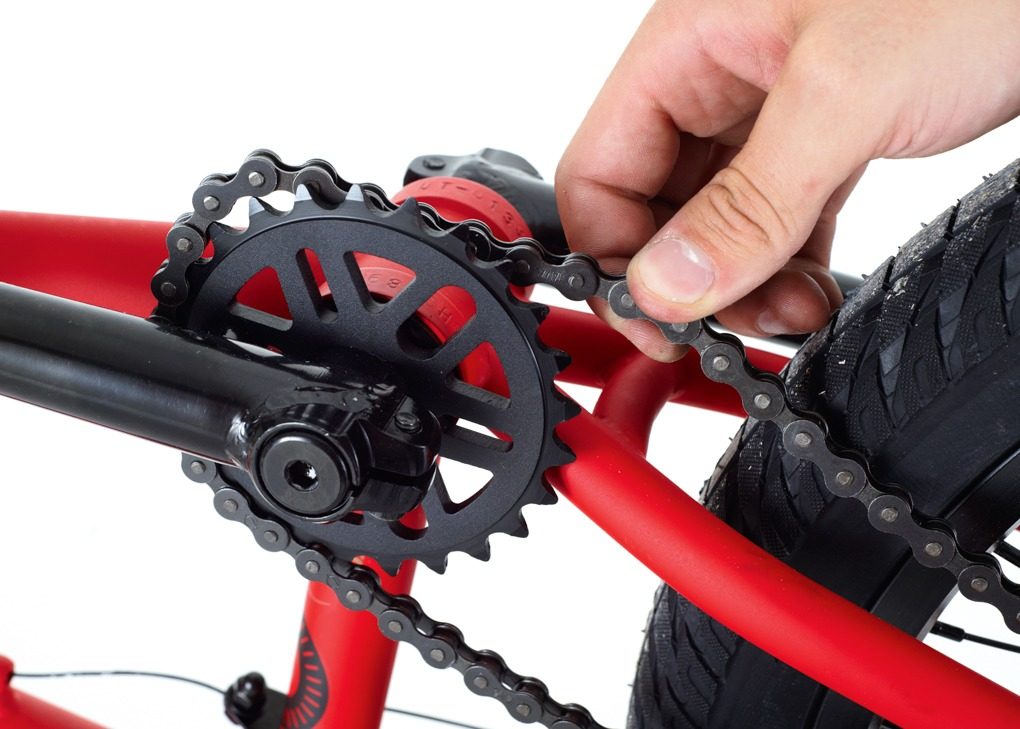 Once the chain is reconnected correctly, place the chain on the rear cog and put
it on as much as you can on the front. If you can, turn the cranks so the chain pulls back onto the chainwheel. If it’s feeling a bit tight, loosen the wheel first.