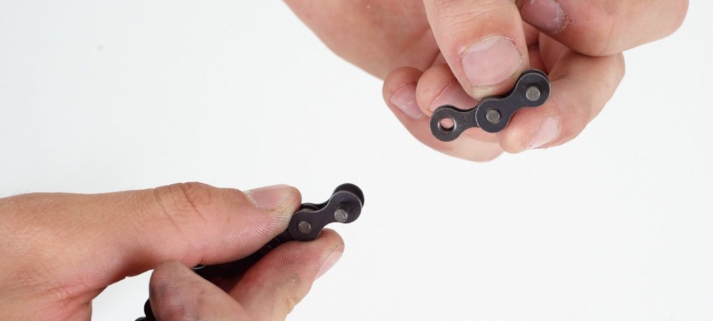Take your spare link. If you don’t have one you’ll be able to pick up some spares from a local bike shop. Make sure it’s the same size as the chain you’re running.