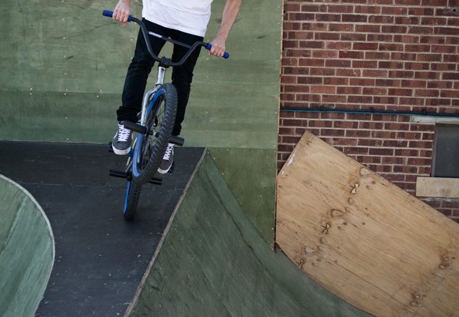 As you approach the edge of the quarter faster than usual, pull the front end up and push it down into the transition, much like you would as you normally drop in, only quicker and more exaggerated.