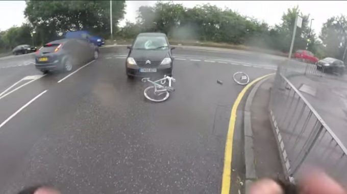 Guy on a bike gets hit by a car and catches it all on a helmet cam!