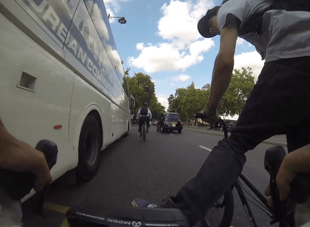 BMXer Kicks Road Cyclist Off His Bike
