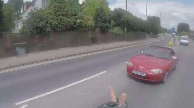 Cycist Gets Instant Karma After Cutting Into Traffic and Flipping Off Motorist